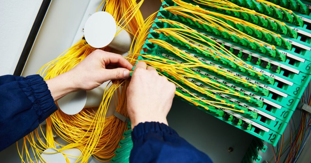 A meticulously organized cable box with numerous wires arranged neatly, highlighting efficient structured cabling management.