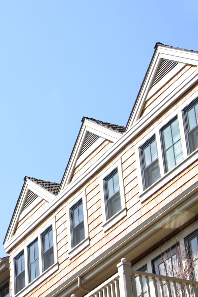 Close-up photo of a house roof, representing residential real estate under IT support services.
