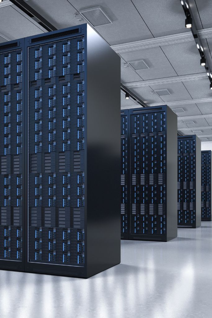 Close-up view of a server rack with visible hard drives and network cables, symbolizing robust IT infrastructure.