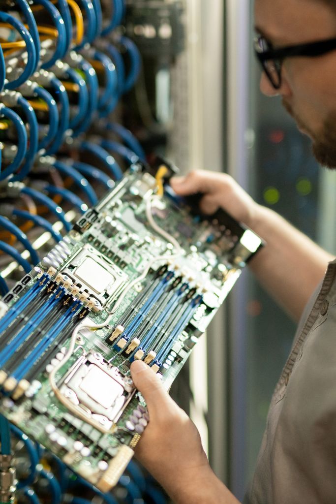 A technician performing network maintenance, ensuring seamless connectivity for businesses in Louisville. We specialize in monitoring, troubleshooting, and upgrading network infrastructure for optimal performance