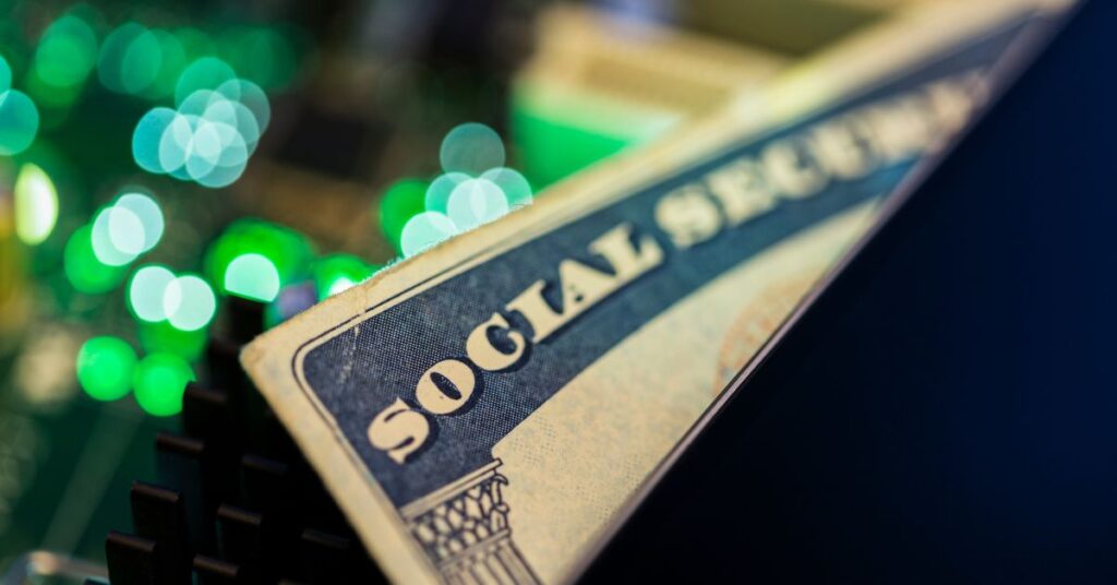 Social Security card resting on a circuit board, representing the importance of protecting personal data from cyber threats. IT GOAT provides advanced cybersecurity measures to protect sensitive information like Social Security numbers from data breaches.