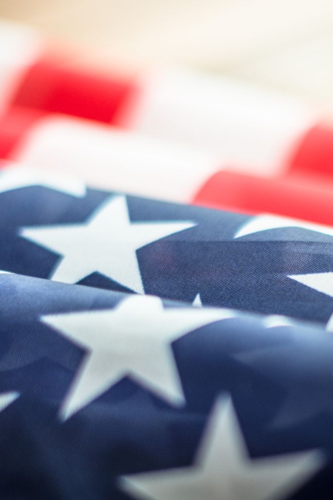 A military contractor securely accessing classified information via a DoD-approved cloud service with strict security clearance-based access control.